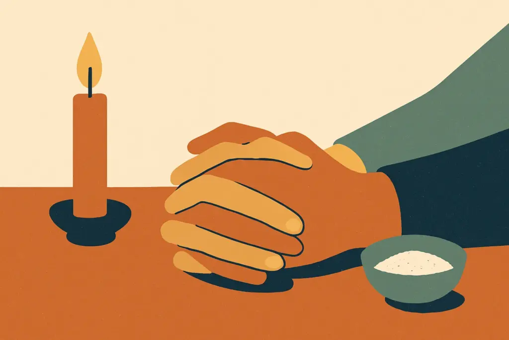 Two hands linked together on a table, with a lit candle and a bowl of salt nearby, symbolizing connection and tradition.